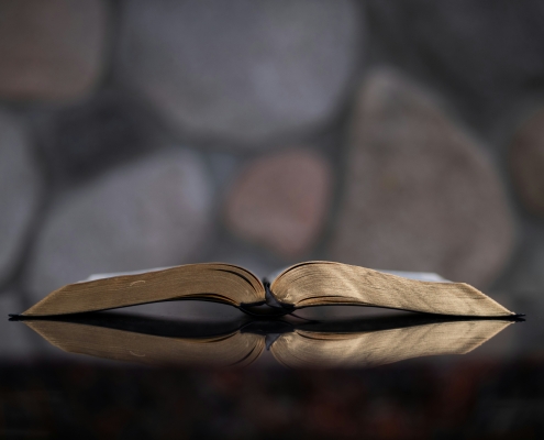Open bible on table.