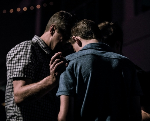 Man giving his life to Jesus.